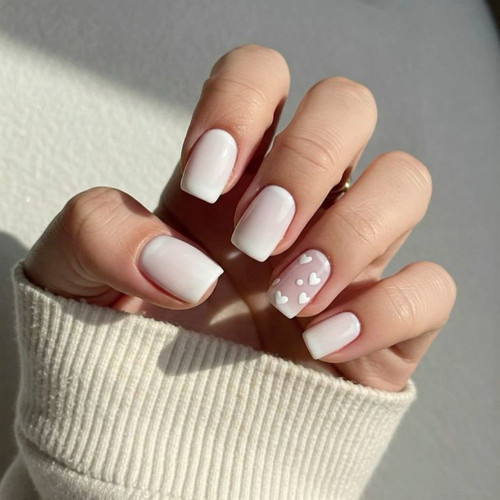 Milky manicure with 3D hearts