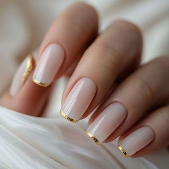 Nude manicure with gold French tips